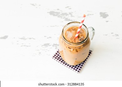 Iced Coffee On Wood Board Background