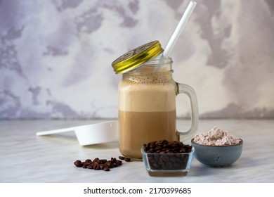 Iced Coffee Protein Shake. Healthy Fitness Drink With Whey Protein. Iced Coffee Milkshake. Ready To Drink At Hot Day After Your Workout. Natural Light, Selective Focus. 