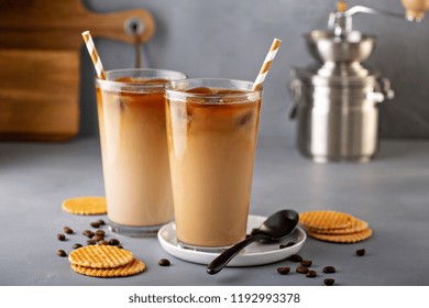 Iced Coffee In Tall Glasses Made With Coffe Ice Cubes Served With Cookies