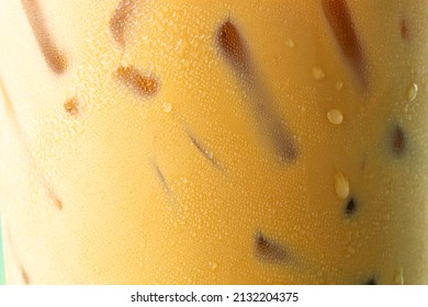 Iced Coffee Texture,Ice Coffee And Drop Milk On Rustic Wooden Table, Close Up Black Ice Coffee With Milk On Top, Selective Focus, Free Space For Text And Toned Image.