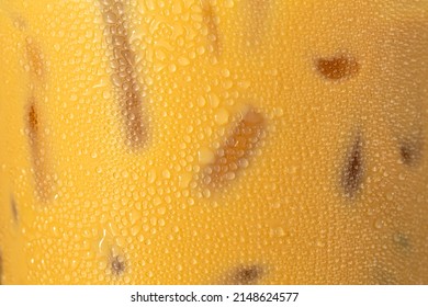 Iced Coffee Texture,Ice Coffee And Drop Milk On Rustic Wooden Table, Close Up Black Ice Coffee With Milk On Top, Selective Focus, Free Space For Text And Toned Image