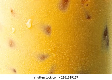 Iced Coffee Texture,Ice Coffee And Drop Milk On Rustic Wooden Table, Close Up Black Ice Coffee With Milk On Top, Selective Focus, Free Space For Text And Toned Image 