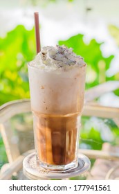 Iced Coffee With Whipped Cream And Sprinkle Cocoa