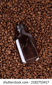 Iced Cold Brew Coffee In Bottle Mockup On Coffee Beans. In Blank Label Bottle. Copyspace