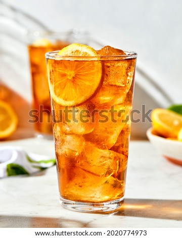 Iced Drink with Garnish and Fruits on top with ice