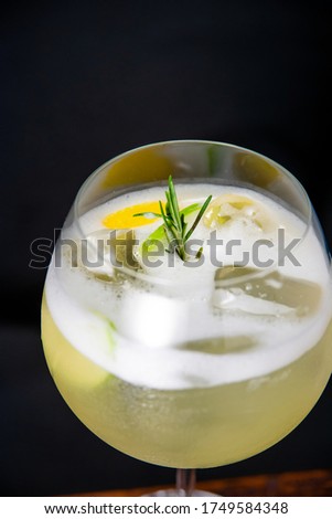 iced fresh cocktail refreshment on dark background