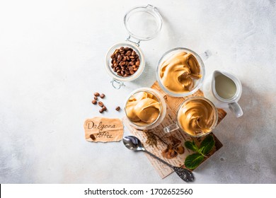 Iced Frothy Drink Dalgona Coffee, Trend Korean Drink Latte Espresso With Coffee. Gray Concrete Background. Flat Lay, Top View