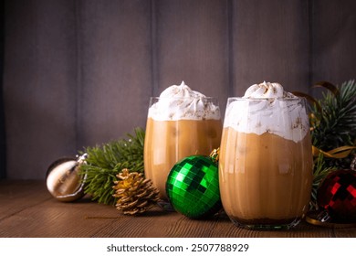 Iced gingerbread latte drink, tasty Christmas New Year beverage hot chocolate or coffee cocktail with whipped cream and gingerbread syrup, with whipped cream, and gingerbread cookie spices  - Powered by Shutterstock