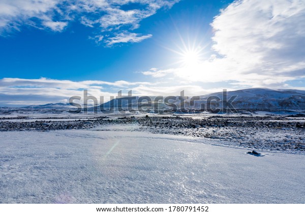 Iced landscape with\
volcanic rocks