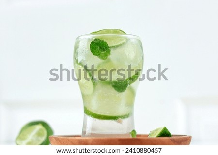 Iced Lime Soda with Mint Leaf on White Background. Summer Refreshing Drink Comcept 