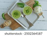 Iced pea soup in glasses. Delicious and healthy homemade summer food