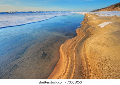 Iced shoreline of Lake Michigan near sunset, Saugatuck Dunes State Park, Michigan, USA