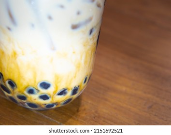Iced Taiwanese Milk Tea with Jelly Pearls in a Plastic Cup Ready to Drink.