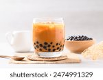 Iced Thai milk tea with boba or Thai bubble tea in glass on white background