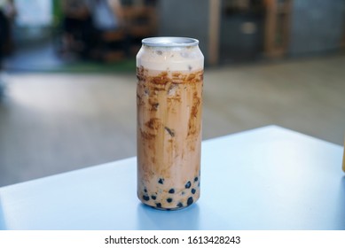 Iced Thai Milk Tea With Bubble Pearls. A Can/bottle Of Thai Milk Tea With Brown Sugar Syrup And Boba/bubble Tapioca Pearls.