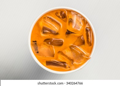 Iced Thai Milk Tea Cold Coffee Close Up, Top View, White Background