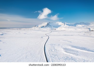 Iceland. Aerial view of the road. Winter landscape from a drone. Traveling along the Golden Ring in Iceland by car. - Shutterstock ID 2200390113