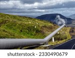 Iceland, Europe - landscape of central Iceland, mountains covered with grass, moss and lava, pipeline along road number 435 from Nesjavellir Geothermal Power Plant to Reykjavik