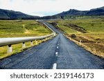 Iceland, Europe - landscape od central Iceland, mountains covered with moss, road number 435 from Nesjavellir geothermal station, pipes with hot water along the road