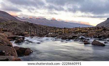 Iceland Fjord sunset glowing white mountain peaks big moving river