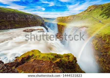 Iceland, Gullfoss waterfall. Captivating scene with rainbow of Gullfoss waterfall that is most powerful waterfall in Iceland and Europe. Picturesque summer scene with amazing Icelandic waterfall.