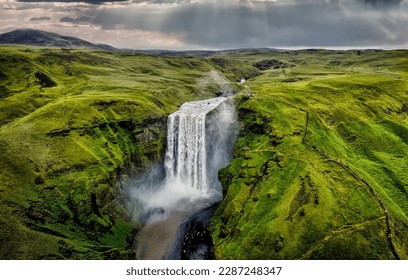 Skógarfoss in Iceland is one of the most visited waterfall in Iceland. It has been used in countless movies and tv shows. On the south coast of Iceland it one if the must see in Iceland  - Powered by Shutterstock