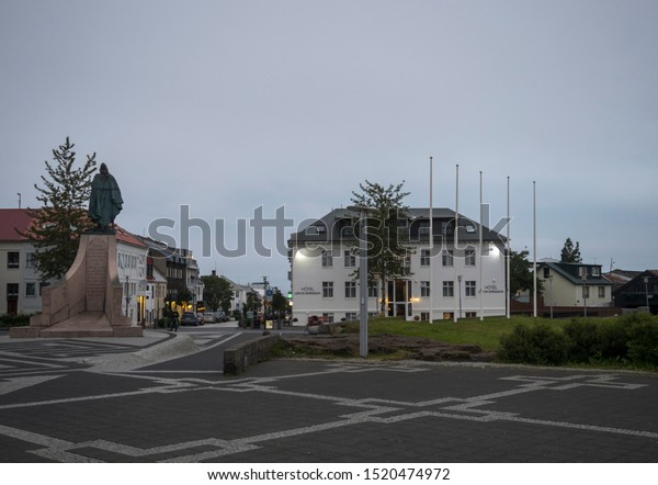 Iceland, Reykjavik, July 30, 2019: Main square in\
Reykjavik city center with Leifur Eiriksson hotel and statue\
momument. Early morning, mooody\
sky.