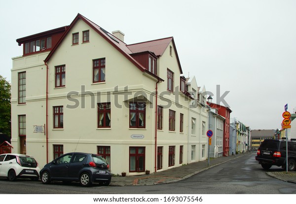 ICELAND, REYKJAVIK -\
JUNE 26, 2019: Gloomy summer day and a walk along the quiet streets\
with small cute houses