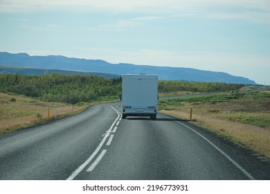 Iceland, Sudurland - August 8th, 2022 - White Camper, RV Driving On A Road