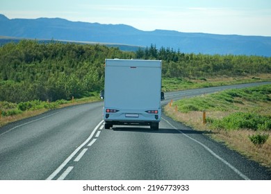 Iceland, Sudurland - August 8th, 2022 - White Camper, RV Driving On A Road