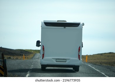 Iceland, Sudurland - August 8th, 2022 - White Camper, RV Driving On A Road