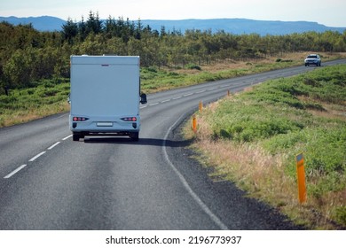 Iceland, Sudurland - August 8th, 2022 - White Camper, RV Driving On A Road