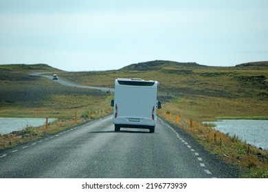 Iceland, Sudurland - August 8th, 2022 - White Camper, RV Driving On A Road