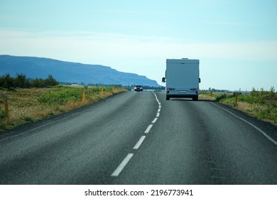 Iceland, Sudurland - August 8th, 2022 - White Camper, RV Driving On A Road