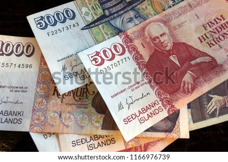 Icelandic cash. Money of Iceland. Several Icelandic krona bills on wooden table. Icelandic krona is the national currency of Iceland (kronur)