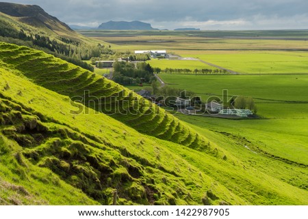 Icelandic farm houses in the middle of a green countryside plain. Skogar, Iceland