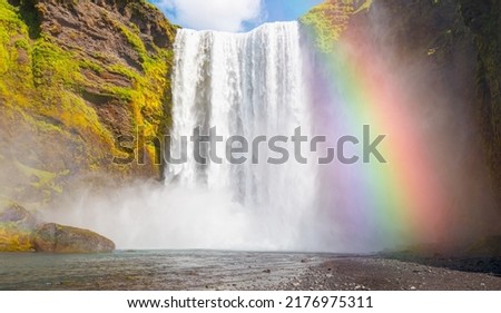 Icelandic Landscape concept - View of famous Skogafoss waterfall and amazing rainbow