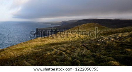 Similar – A big cloud hangs over a fjord