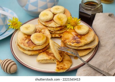 Icelandic traditional oatmeal pancakes Lummur with bananas and honey - Shutterstock ID 2221565413