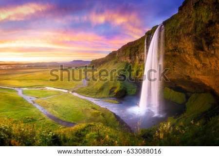 Icelandic waterfall Seljalandsfoss at sunset