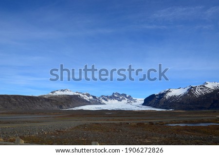 Similar – Image, Stock Photo Snow-covered mountain and Icelandic moss