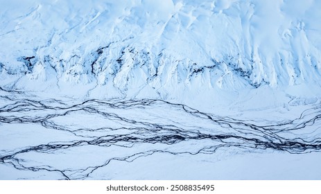 Iceland's Winter Majesty, Frozen Rivers and Snowy Peaks, Aerial Winter Wonderland, panoramatic format 16:9. White edit space. Frozen Rivers Along the Thorsmork Trail - Powered by Shutterstock