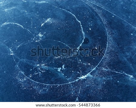 iceskating scratches on a darkblue ice surface.