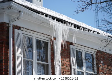 Icicle On The House Roof In Winter Season     