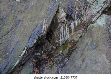 Icicles Drip From Rock Formations