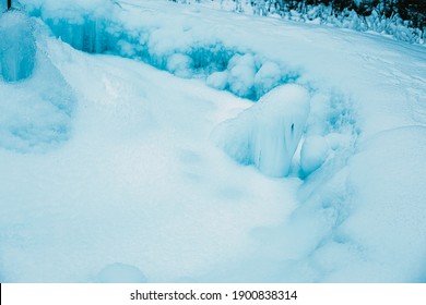 Icicles Formed Around Frozen Geyser.Winter Image.High Quality Photo