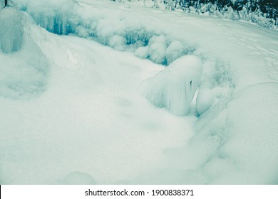 Icicles Formed Around Frozen Geyser.Winter Image.High Quality Photo