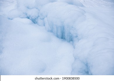 Icicles Formed Around Frozen Geyser.Winter Image.High Quality Photo