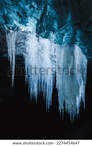 Icicles hanging from a roof of an ice cave in island