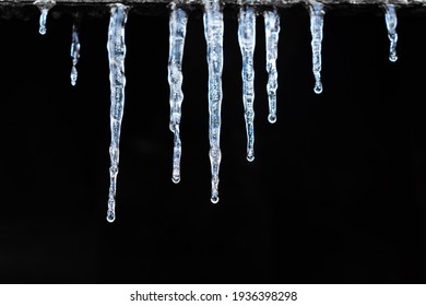 Icicles hanging in a row